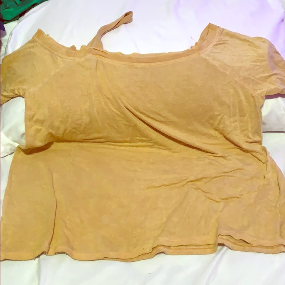 Yellow off the shoulder tee shirt.